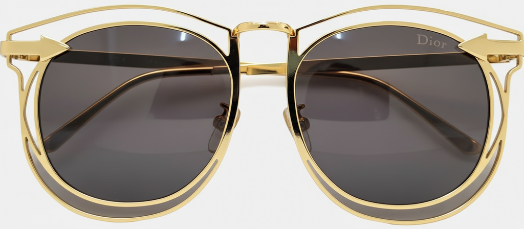 Gold-framed sunglasses with dark lenses on a white background